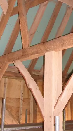 timber beams in listed barn building